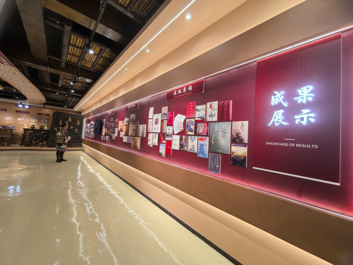 传习中心成果展示墙：羌族文化研究专著、出版物与获奖作品悉数陈列